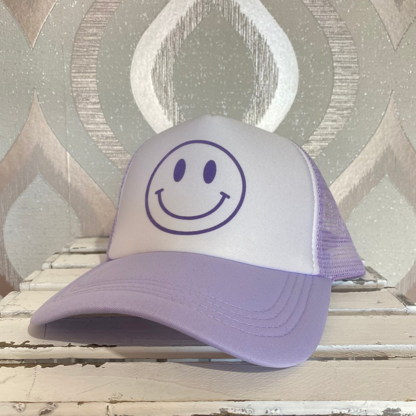 H100 Purple smiley face trucker hat